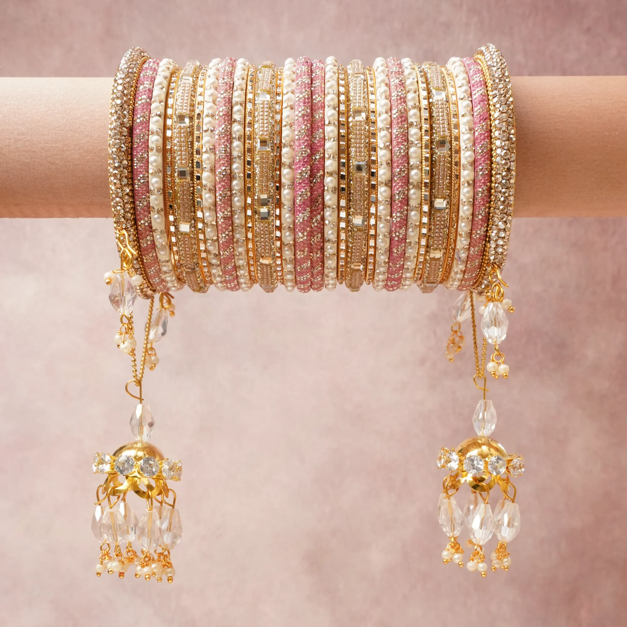 A majestic Gold set, complemented by Rose Pink, Ivory, Clear featuring Gold-toned Metal (Alloy), Enamel/Resin, Imitation Pearls, Cubic Zirconia, Faceted Glass/Crystal.
Rich, ceremonial, and designed to be passed through generations.
